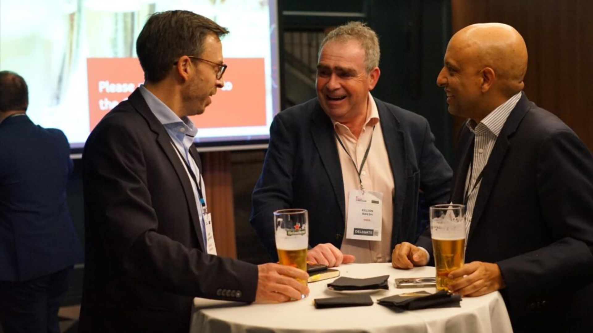 Delegates networking at the symposium