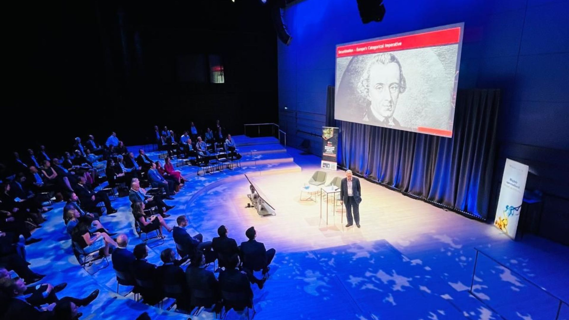 PCS Symposium keynote presentation on stage